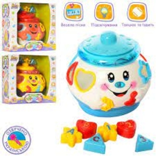 Гра 0915 UA (24шт) Горшочек,16см,сортер,муз(укр),свет,ездит,фигурк6шт,3цвета,на бат,кор,23-23-15см